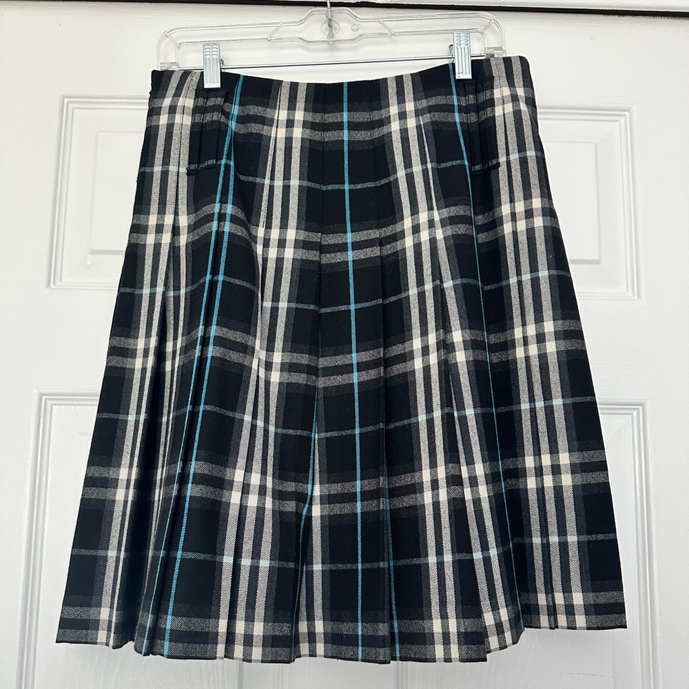 Burberry midi blue and black tartan skirt.